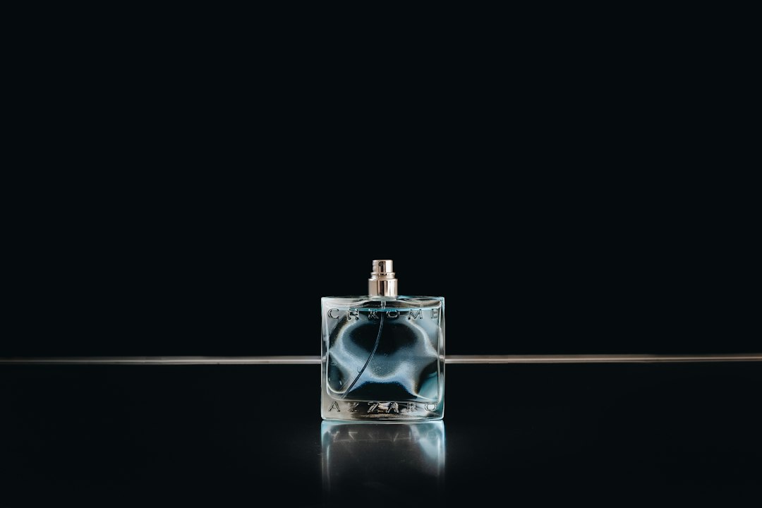Glass fragrance bottle on a black background